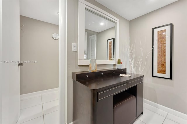 bathroom with tile patterned flooring and vanity