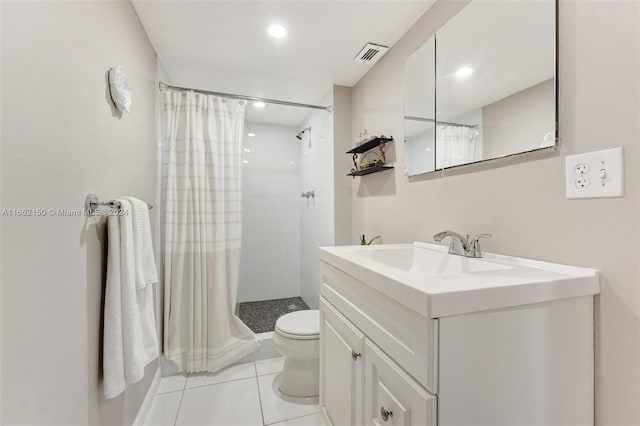 bathroom featuring tile patterned floors, a shower with curtain, vanity, and toilet