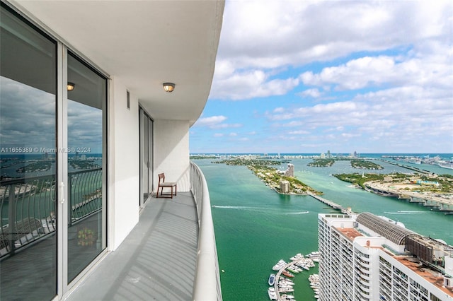 balcony featuring a water view