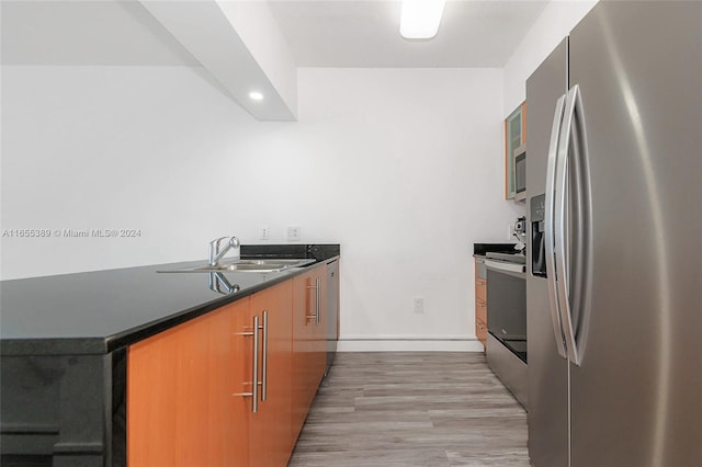 kitchen featuring light hardwood / wood-style floors, sink, and stainless steel appliances