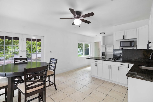 kitchen featuring ceiling fan, light tile patterned flooring, sink, white cabinetry, and stainless steel refrigerator with ice dispenser