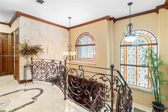 interior space with crown molding and a chandelier