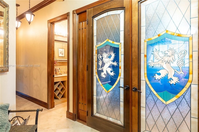 interior space featuring french doors and ornamental molding