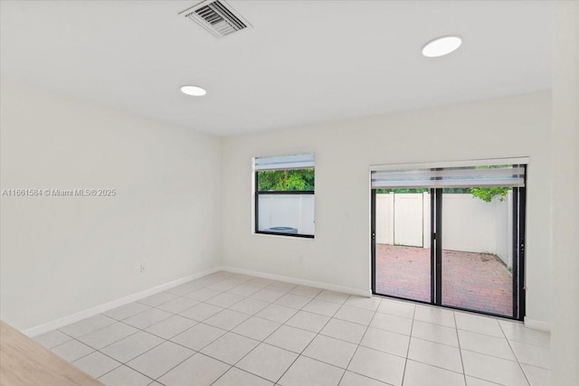 spare room featuring light tile patterned floors