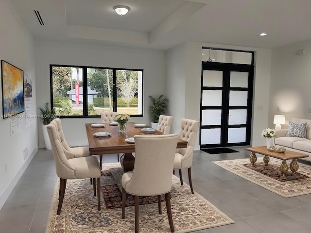 24440 SW 209th Pl, Homestead, FL 33031 - dining room with baseboards and a tray ceiling