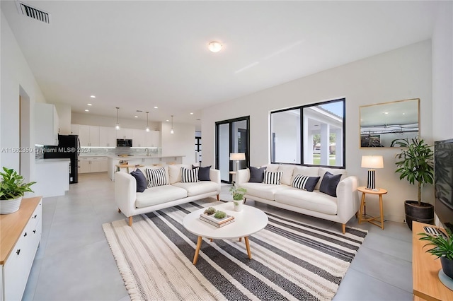 living room featuring sink