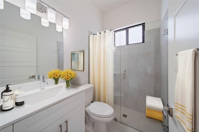 bathroom with a shower with shower curtain, tile patterned flooring, vanity, and toilet