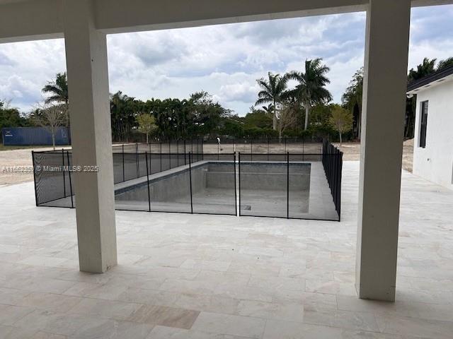 24440 SW 209th Pl, Homestead, FL 33031 - view of swimming pool with a patio