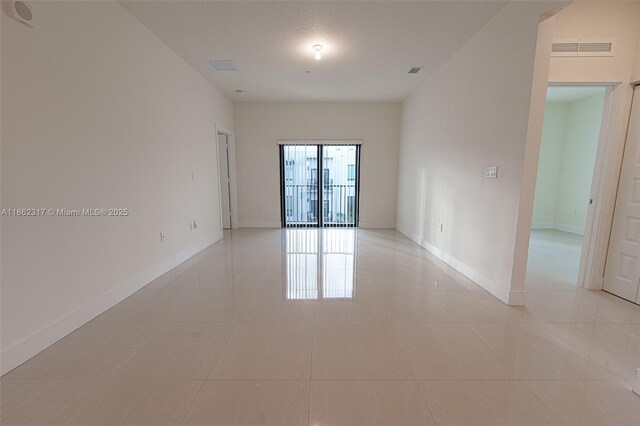 view of tiled spare room