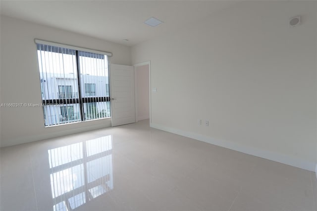 view of tiled spare room