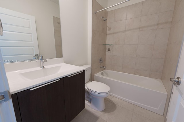 full bathroom with tile patterned flooring, vanity, toilet, and tiled shower / bath