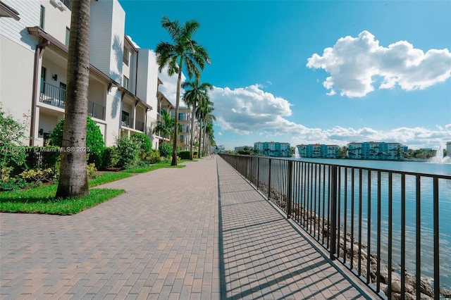 surrounding community with a water view