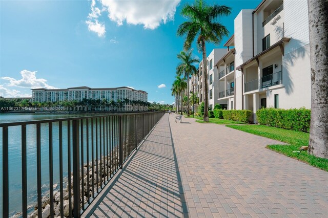 surrounding community with a water view