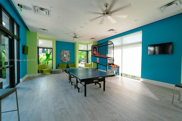 playroom featuring ceiling fan and light hardwood / wood-style floors