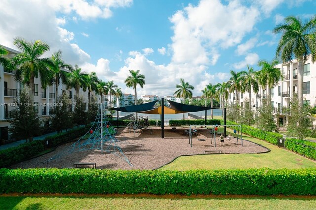 view of playground with a lawn