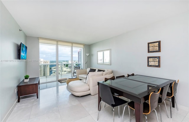 interior space with light tile patterned floors and expansive windows