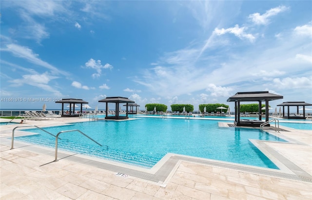 view of pool featuring a gazebo and a patio