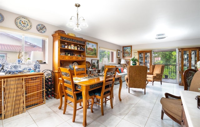 dining room featuring light tile patterned floors and a chandelier