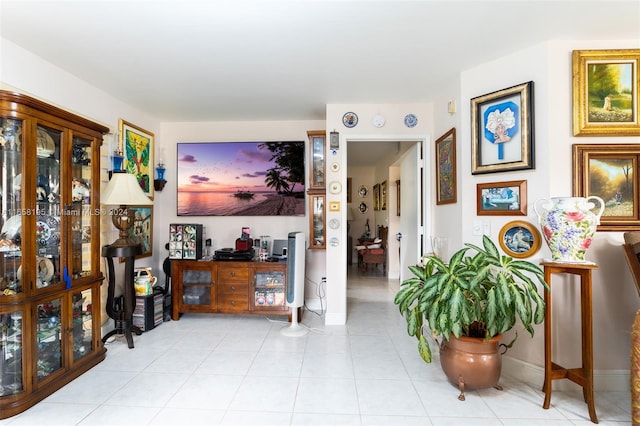 hall featuring light tile patterned floors