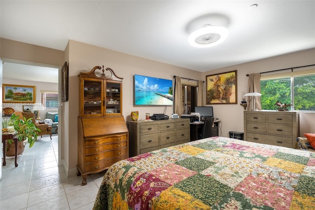 bedroom with light tile patterned floors