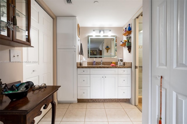 bathroom featuring vanity and tile patterned flooring