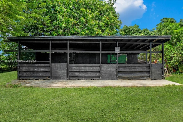 view of outbuilding featuring an outdoor structure and an exterior structure