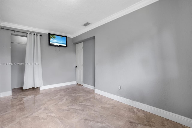 unfurnished bedroom featuring baseboards, visible vents, and ornamental molding