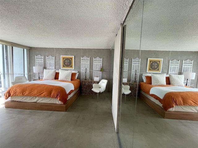 bedroom featuring concrete flooring