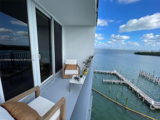 balcony featuring a water view