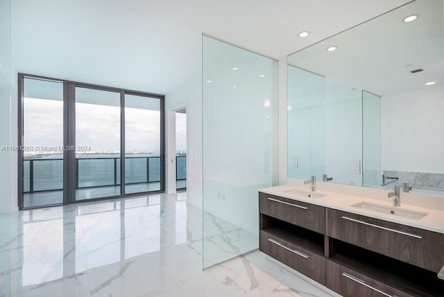 bathroom with vanity and expansive windows