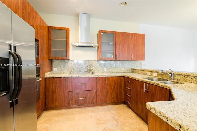 kitchen with light stone counters, sink, decorative backsplash, stainless steel appliances, and exhaust hood