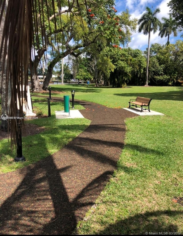 view of home's community featuring a lawn