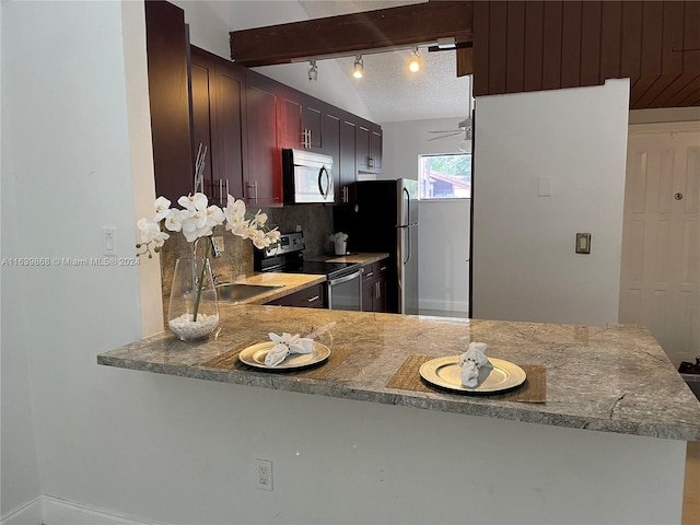 kitchen featuring lofted ceiling with beams, sink, kitchen peninsula, backsplash, and appliances with stainless steel finishes