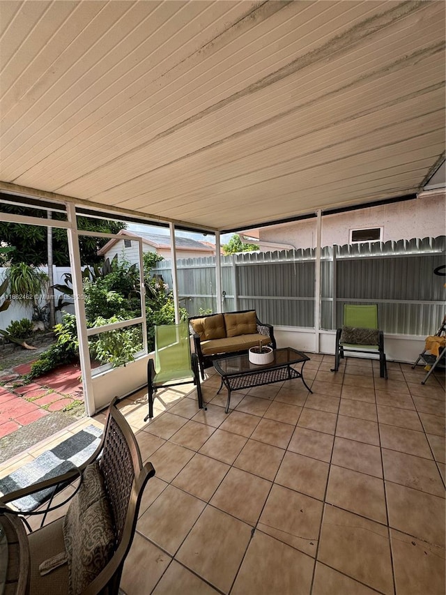 sunroom with wooden ceiling