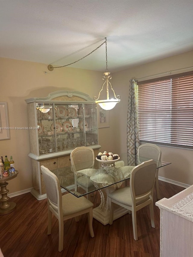 dining area featuring dark hardwood / wood-style floors