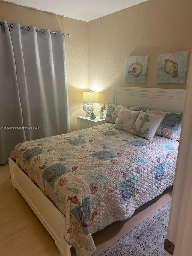 bedroom with light hardwood / wood-style flooring