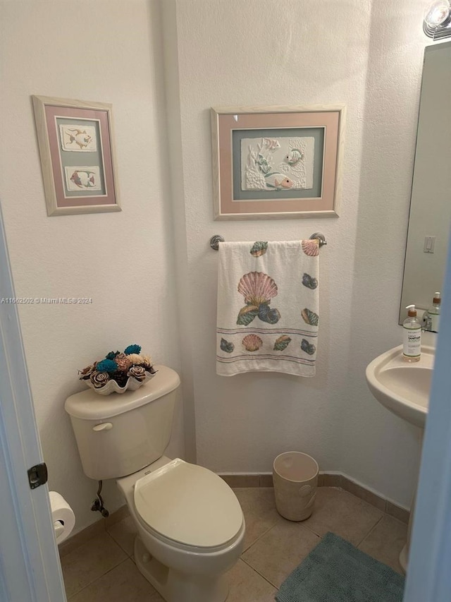 bathroom featuring tile patterned flooring and toilet