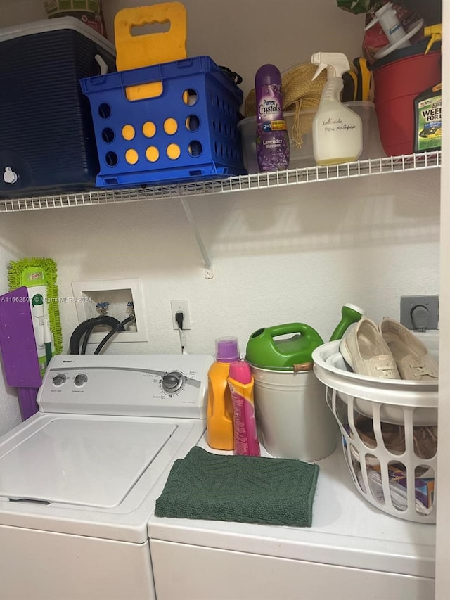 clothes washing area with washer and dryer