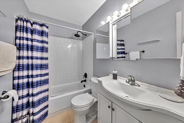 full bathroom with vanity, shower / bath combo with shower curtain, toilet, and tile patterned flooring