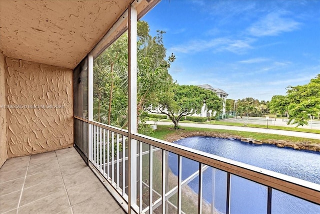 balcony featuring a water view