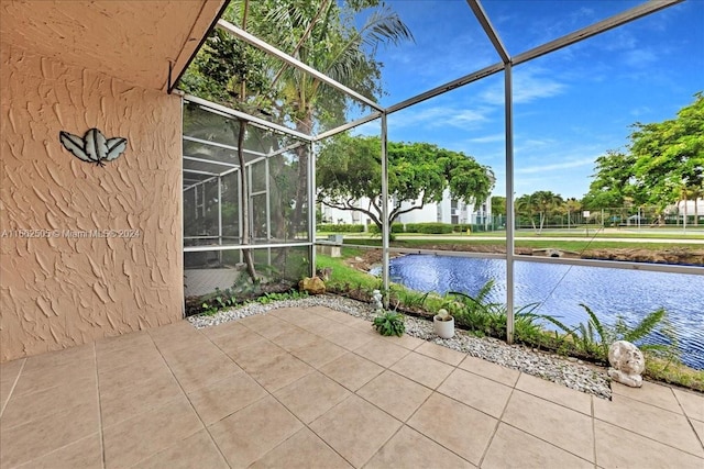 unfurnished sunroom with a water view