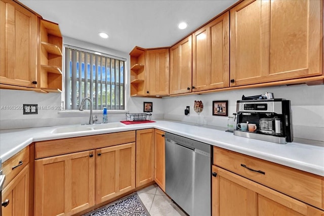 kitchen with sink, dishwasher, and light tile patterned floors