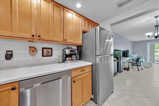 kitchen with stainless steel appliances, light tile patterned flooring, a chandelier, and hanging light fixtures