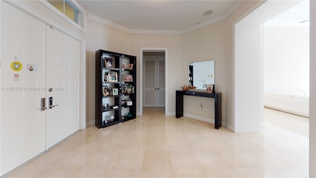 corridor with crown molding and light tile patterned floors