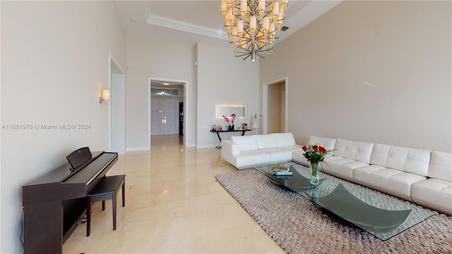 living room featuring a notable chandelier and a towering ceiling