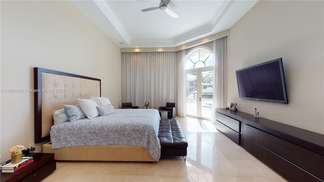 bedroom featuring ceiling fan, ornamental molding, a tray ceiling, and access to exterior