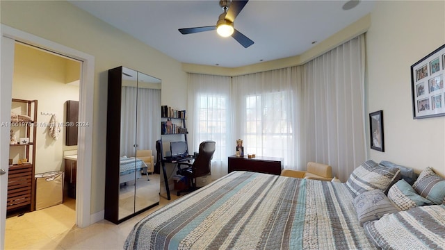 bedroom with ceiling fan and a closet