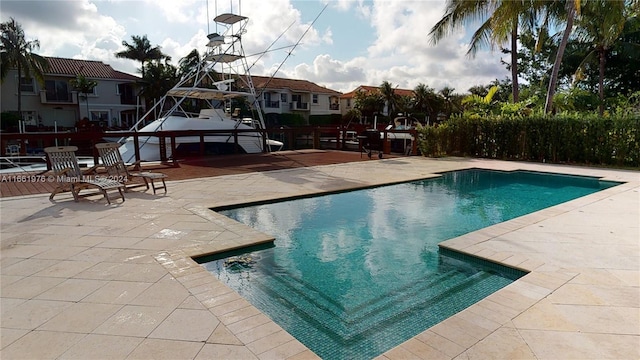 view of swimming pool featuring a patio