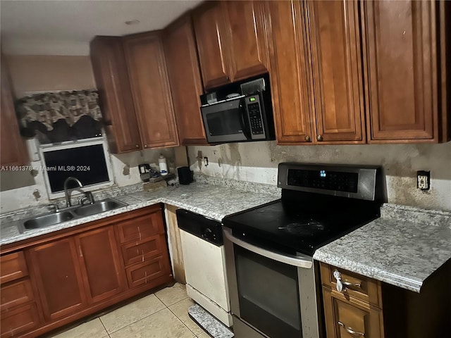 kitchen with light stone counters, sink, stainless steel electric range oven, light tile patterned floors, and white dishwasher