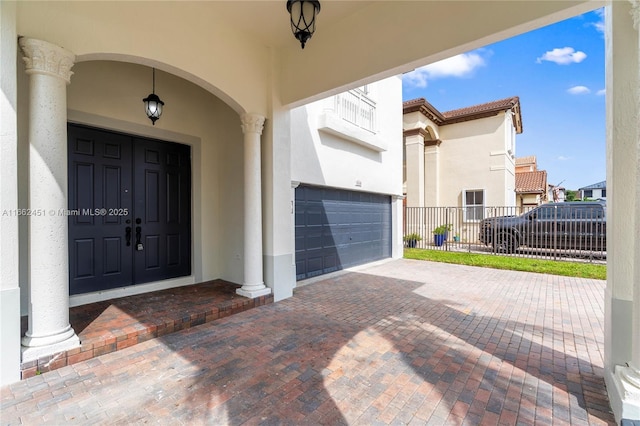 view of exterior entry featuring a garage